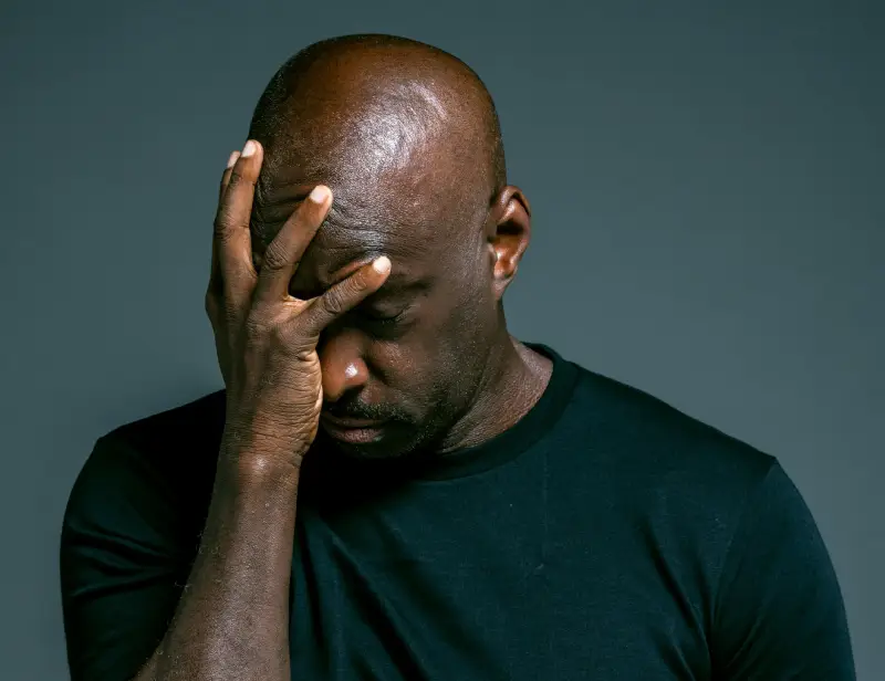 worried-black-man person-infront-of-counsellor